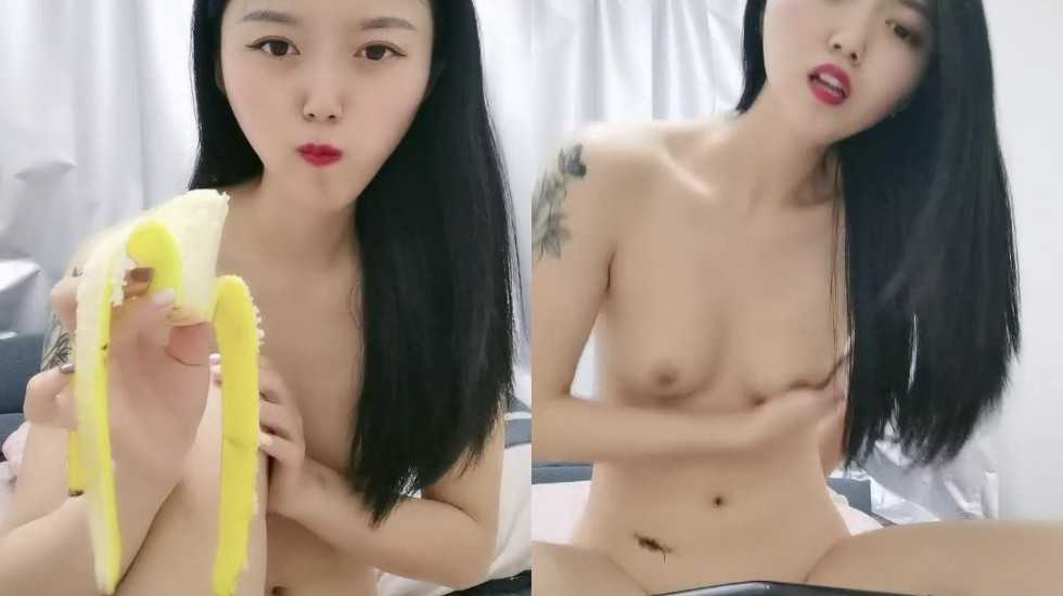 Showing sexy little fox with sexy tattoos and attractive breasts, using bananas as props to insert into pink holes