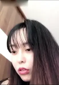 Beautiful young woman in see-through dress with open crotch black stockings and props masturbating